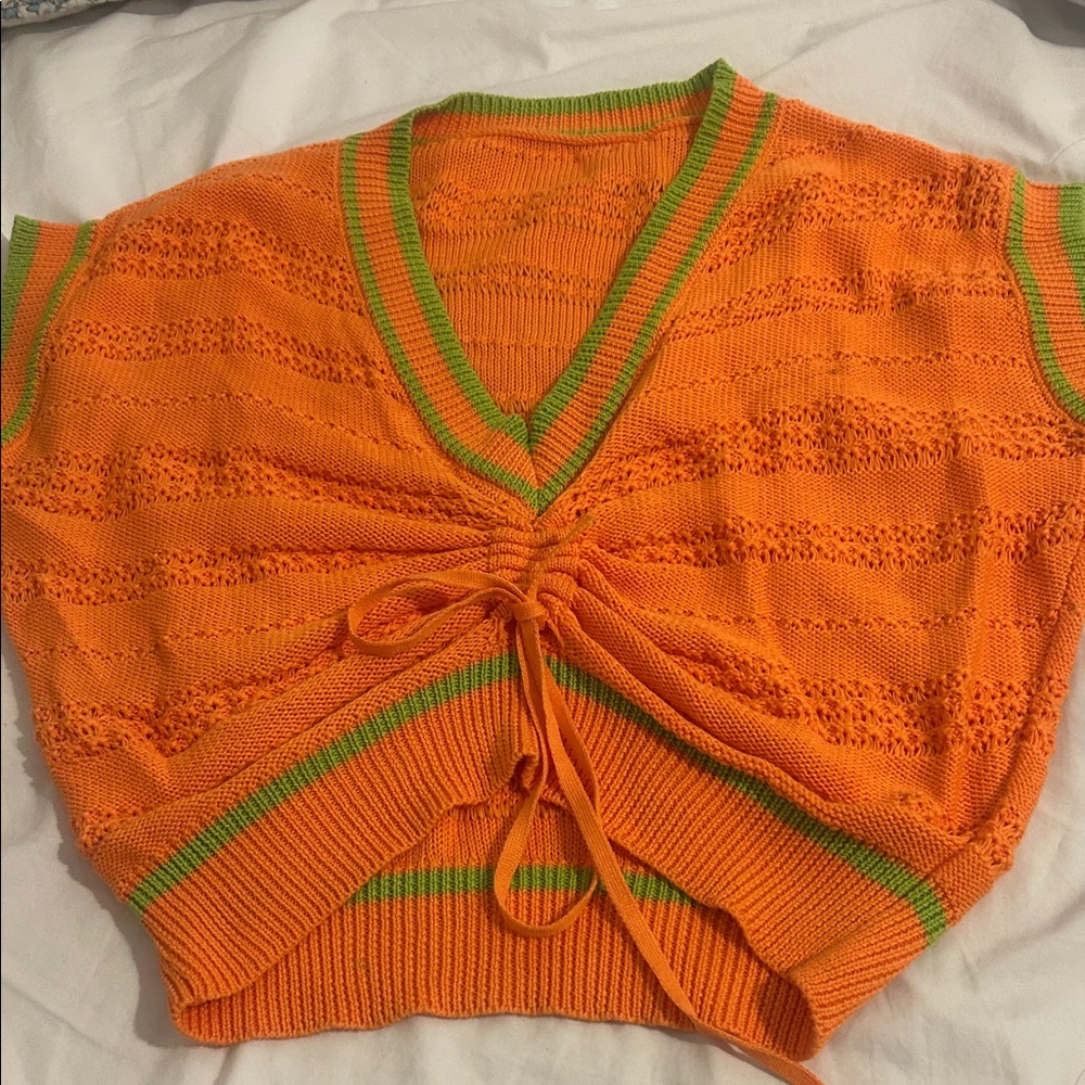 Orange V-Neck Sweater with Green Accents